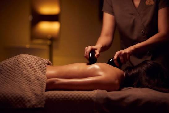 Hot Stone Massage treatment room — Natural Spa DMCC